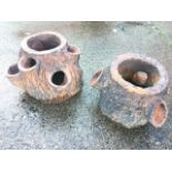 A pair of Victorian terracotta plant pots cast as treetrunks with naturalistic bark moulding, one