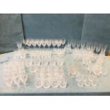 A large collection of cut drinking glasses by Brierley and Edinburgh Crystal including tumblers,
