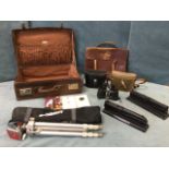Miscellaneous collectors items - a lined leather suitcase, a cased tripod, a pair of coal resin