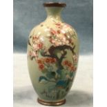 An eastern cloisonné vase of ovoid form decorated with birds, flowers and blossom foliage on blue/