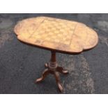 A Victorian walnut chess table, the rectangular rounded top inlaid with a chequered board framed