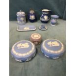 A collection of Wedgwood jasperware - pots & covers, a pin tray, a jug, a vase, lidded bowls, a