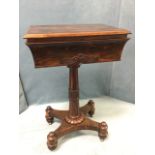 A Victorian rosewood teapoy with rectangular moulded top revealing an interior with four hinged