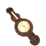 A large Victorian maritime barometer, the carved oak case with ropetwist rim having crown above an