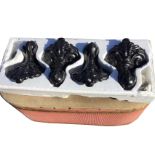 A boxed set of four cast iron bath supports with ball & claw feet beneath acanthus scrolled