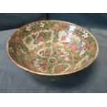 A Chinese famile rose bowl decorated with alternating figural and floral scrolled panels on flower