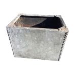 A heavy rectangular galvanised tank of riveted construction with flat rim. (27.25in x 20in x 21in)