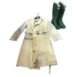 A 60s vulcanised riding mack by Weatherwear Ltd with tartan lining; and a pair of size 6 Hunter