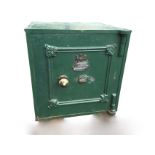 A Victorian cast iron safe by E Cotterill & Co of Birmingham, the panelled door with scroll