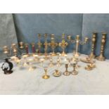 A collection of silver plated and brass candlesticks - mainly pairs including candelabra, fleur-de-