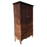 A nineteenth century oak press cupboard with moulded cornice above pair of panelled doors