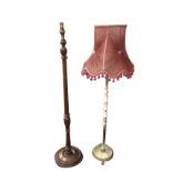 A mahogany standard lamp with tapering turned column on circular moulded base with bun feet; and