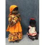A black Pedigree doll with brown sleep eyes and battery growler, wearing cotton dress - 15.25in; and