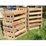 Twelve rectangular agricultural vegetable boxes with slatted bases and side handles - some