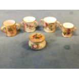 Four Worcester blush ivory miniature floral loving cups; and a similar floral bulbous trinket