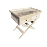 A limed pine side table with rectangular tray top above two drawers with brass knobs, supported on