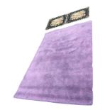 A modern Turkey made purple rug - 77.5in x 52in; and a floral Axminster style rug woven with twin