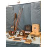 Miscellaneous collectors items including two old fishing rods - one with brass reel, an oak cased