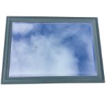 A rectangular mirror, the bevelled plate in a moulded painted frame. (39in x 28in)