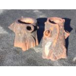 A pair of Victorian terracotta garden log plant pots naturalistically bark moulded, each with