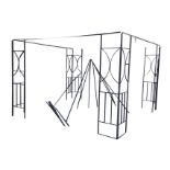A metal garden gazebo with four corner sections having vertical bars beneath crescent panels, joined