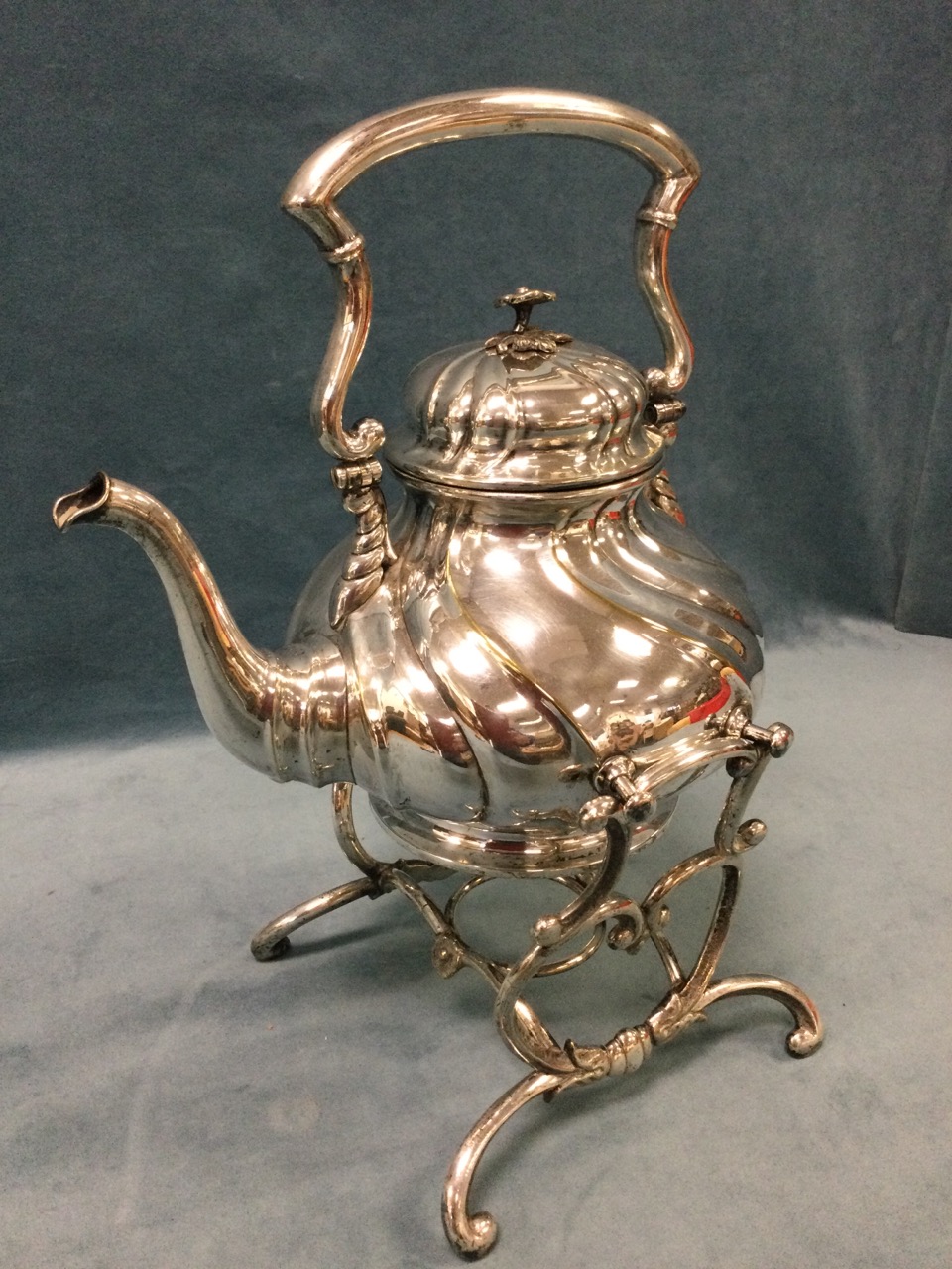A large early Victorian silver plated tea kettle on stand, the gadroon moulded vessel with swing