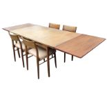 A 60s 8ft teak G-plan table & chair set, the table with two spare leaves raised on turned legs,