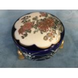 A Japanese stoneware satsuma bowl & cover decorated with scalloped gilt framed panel of blossom