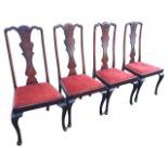 A set of four Edwardian stained Queen Anne style dining chairs, the shaped splats with shell carving