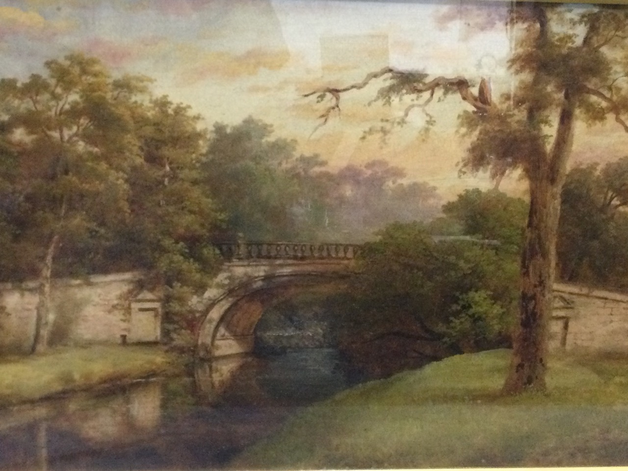 Nineteenth century English school, oil on canvas, balustraded stone bridge over river with trees,