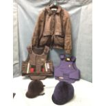 Two pairs of riding hats and body protectors; and an Andrew Marc leather bomber jacket. (5)