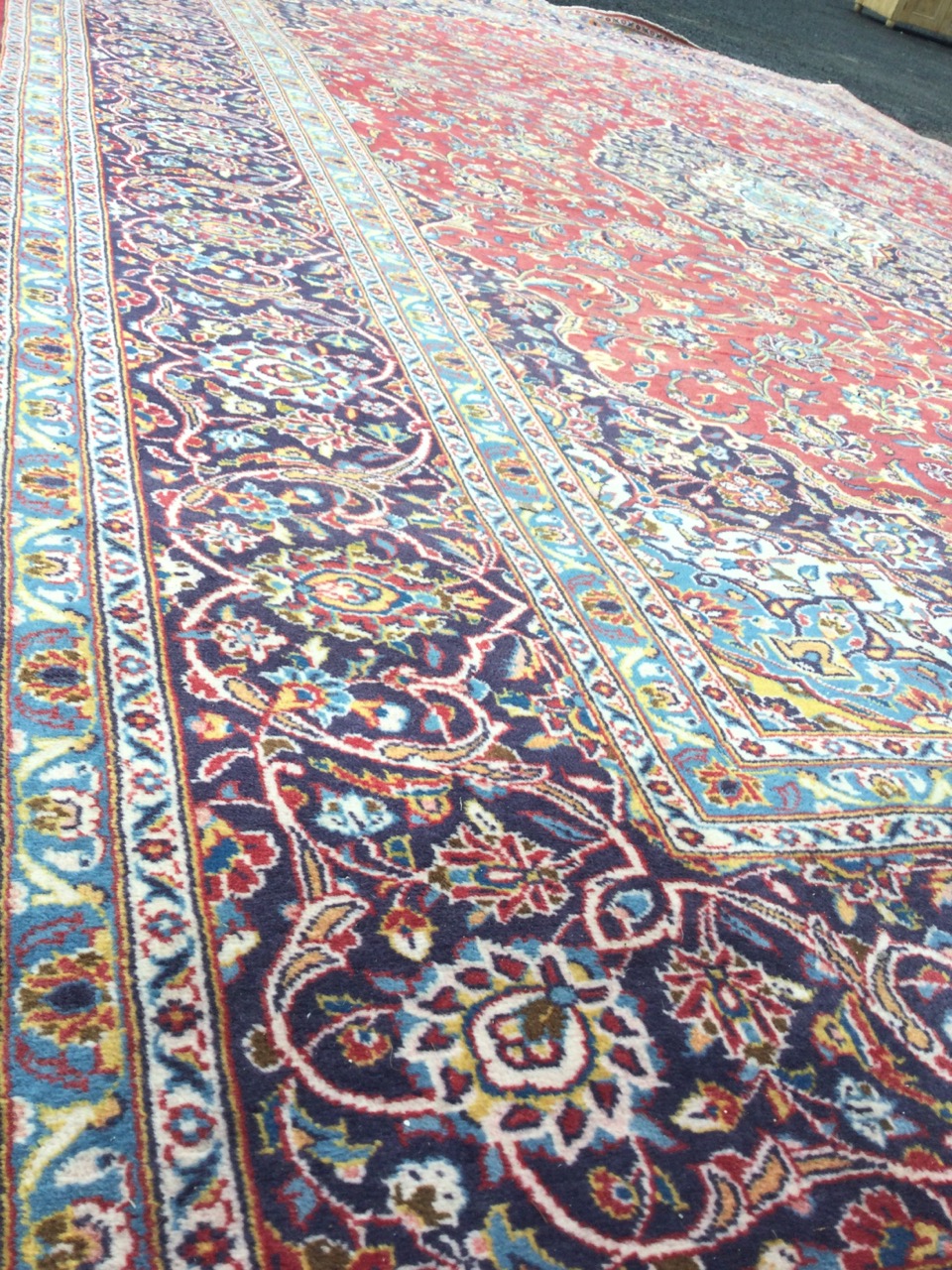 A large Indian carpet woven with ink blue spandrels and conforming central floral medallion on - Image 3 of 3