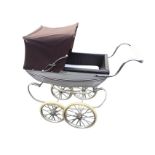 A Silver Cross childs pram with concertina hood to lined tin body with loose mattress, supported