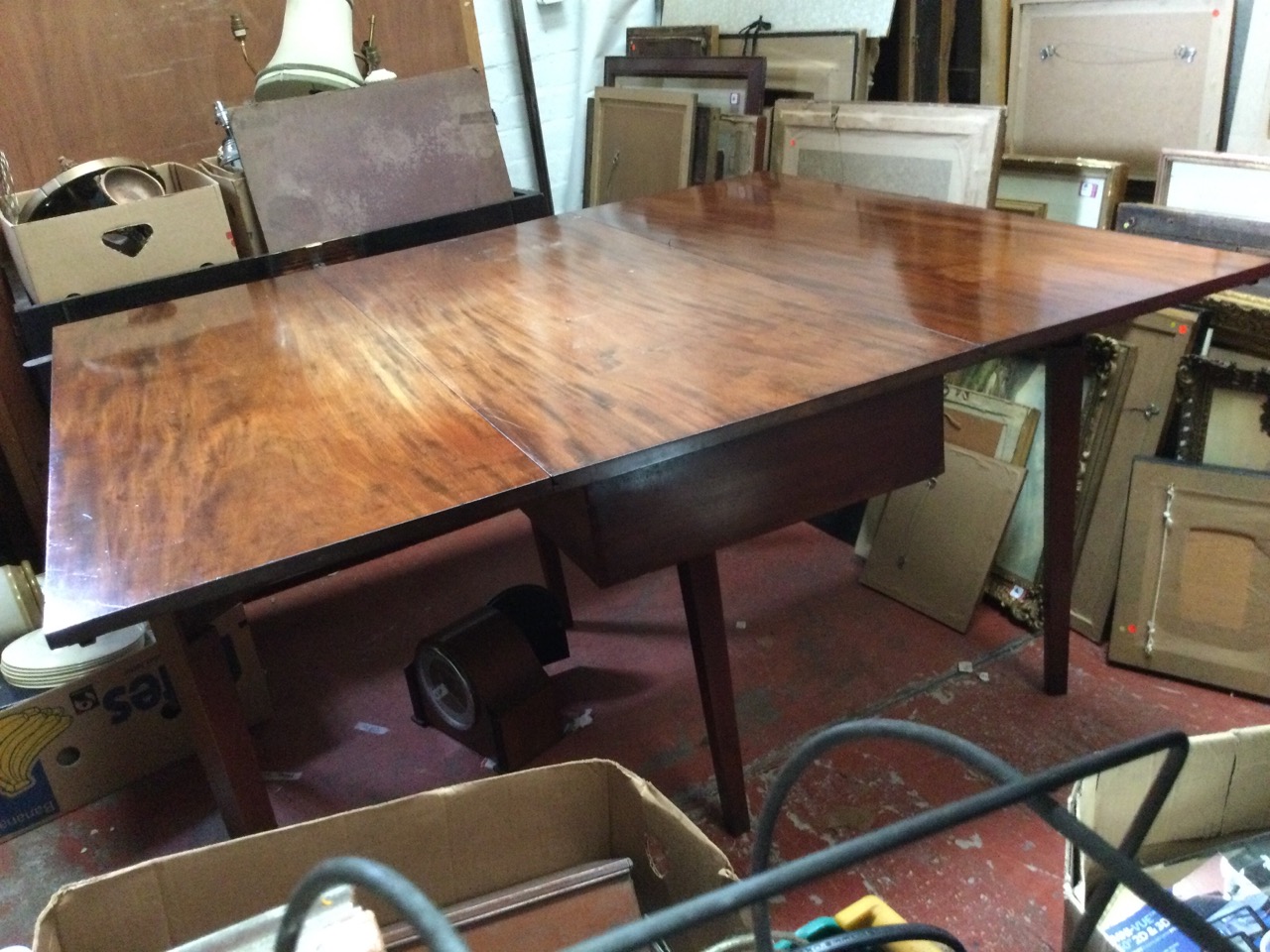 A nineteenth century mahogany dining table with drop-leaves, the rectangular top on six square - Image 3 of 3