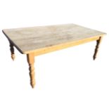 A large 7ft oak farmhouse kitchen table, the rectangular moulded top with rounded corners, supported