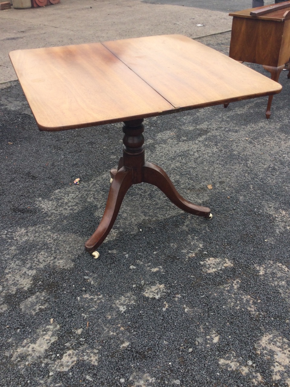 A Victorian mahogany turn-over-top tea table, the twin top supported on a turned column, with - Image 2 of 3