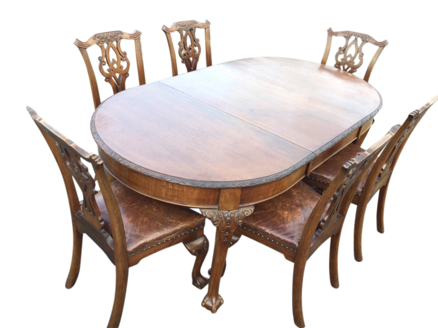 A late Victorian mahogany dining table & chair set, the extending table having rounded ends carved