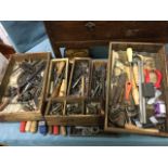 A oak wardrobe base with long drawer full of tools￼ - old wood planes, a tap & die set,