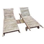 A pair of rectangular hardwood sunloungers, the slatted beds with hinged adjustable backrests to