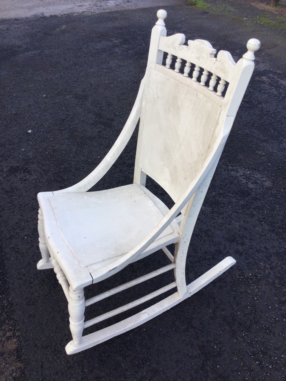 A late nineteenth century painted rocking chair with spindle gallery to back beneath a carved - Image 2 of 3