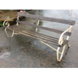 An Edwardian 6ft wrought iron garden bench with slatted back and seat, the ends with scrolled arms