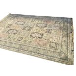 An Axminster style carpet woven in the oriental Huali pattern with rectangular floral panels with