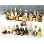 A collection of spirit miniatures - mostly sealed, novelty, ceramic, liqueurs, etc. (31)