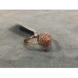A 9ct gold ring pave set with tiers of teardrop shaped natural pink diamonds, with further small