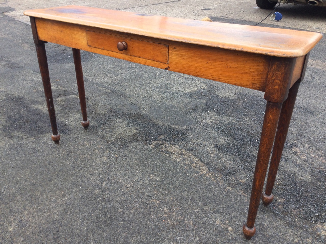 An unusual narrow oak nineteenth century hall table, the rectangular rounded top above a central - Image 2 of 3