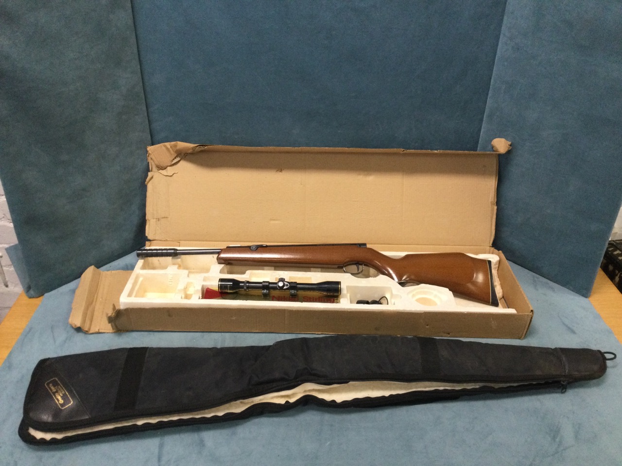 A boxed Webley & Scott .22 air rifle, The Tracker with beech stock and side spring, together with