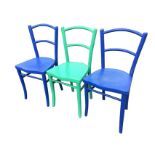 A set of three painted bentwood chairs with bar backs and shaped scrolled press moulded seats,