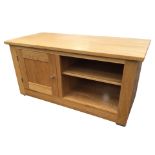 A contemporary oak side cabinet with rectangular top above a panelled cupboard and open compartment,
