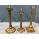 A Victorian brass candlelight with fluted column above a circular leaf cast weighted base, with