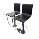 A pair of contemporary Italian bar chairs, the leather type seats on rise-&-fall chrome columns with